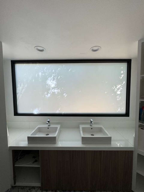 Frosted-mode switchable PDLC smart film on the same residential bathroom window post-install