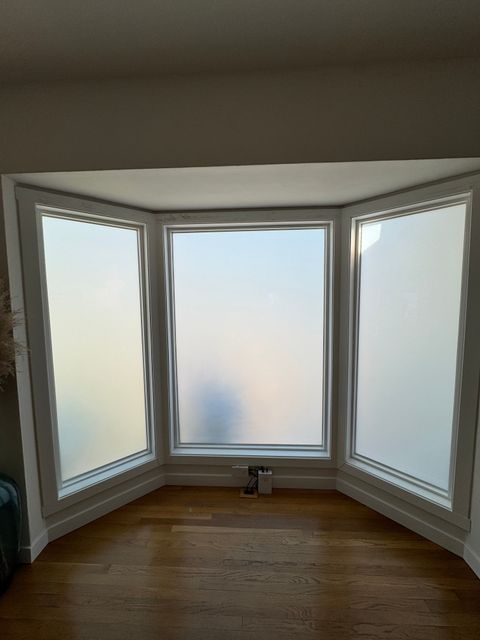 The same Los Angeles bay window switched to frosted privacy, the street no longer visible