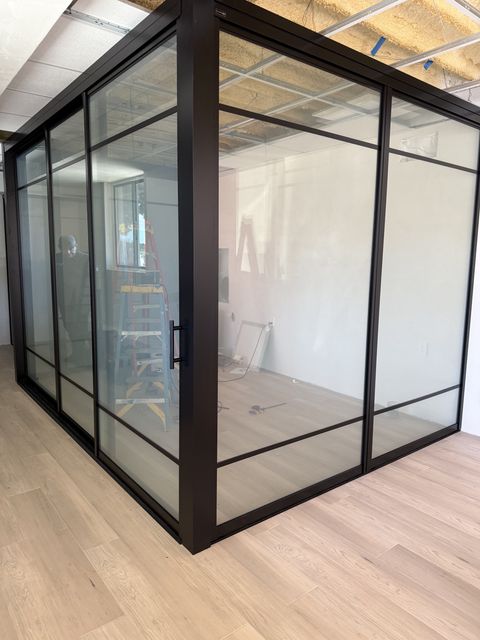 A steel-framed switchable smart glass partition in a Santa Barbara property frosted to opaque privacy