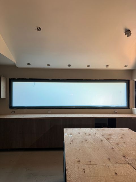 Tall frosted switchable smart glass privacy panel in a Seal Beach home