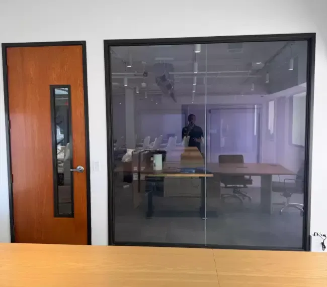 Switchable smart film applied to a consultation-room window for glare reduction and patient confidentiality